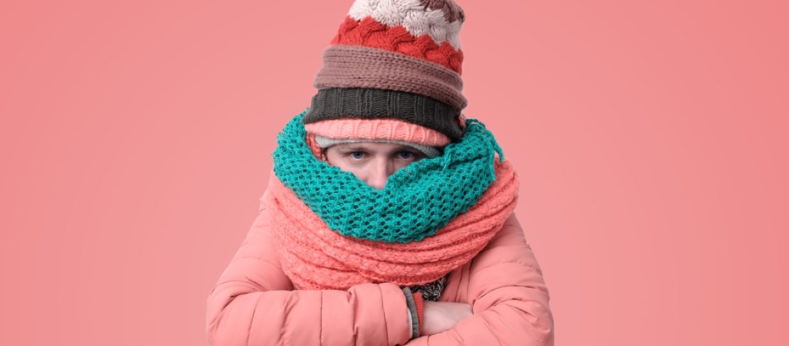 Handsome,Caucasian,Funny,Man,In,Several,Hats,And,Scarfs,Being